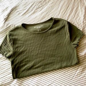 Tight fitted green shirt